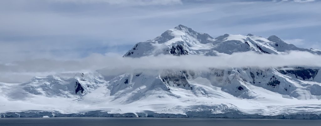 A landscape of the snow covered mountains of Damoy Point, Antarctica.