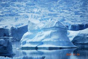 An iceberg with a glacier in the background, Neko Harbour Antarctica