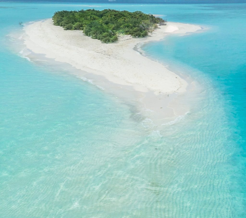 Aerial view of uninhabited tropical island.