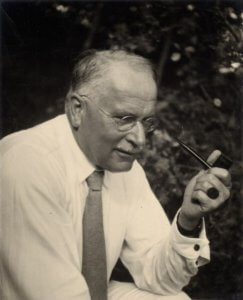 Picture of Carl Jung holding a smoking pipe.